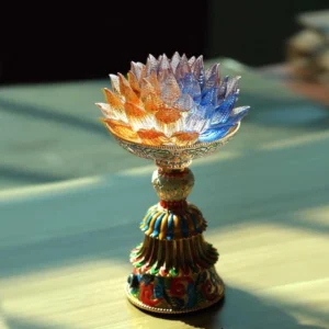 Liuli glass lotus enlightenment lamp with multicolor gradient petals and decorative enamel base on wooden table