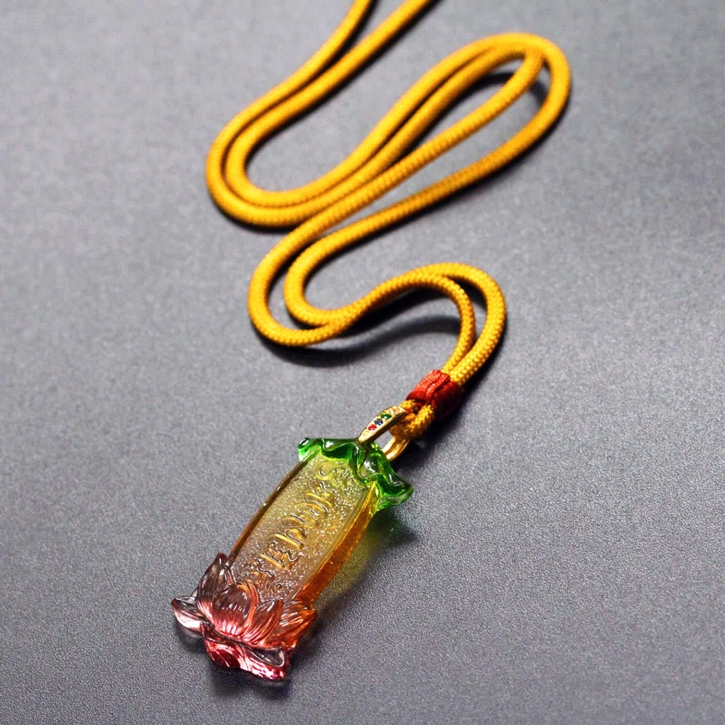 Full length Buddhist Liuli lotus necklace with Om Mani Padme Hum pendant on yellow braided cord, hanging display view