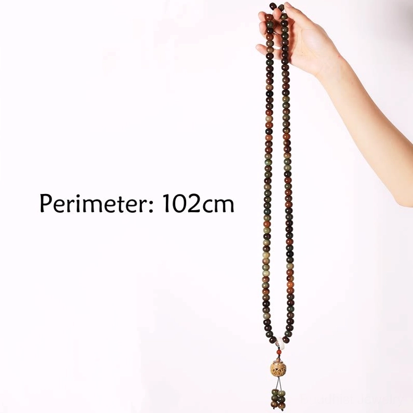 Long 108 mala prayer beads necklace displayed vertically with arm-held view, showing 102cm total length marked, earthy beads and tassel