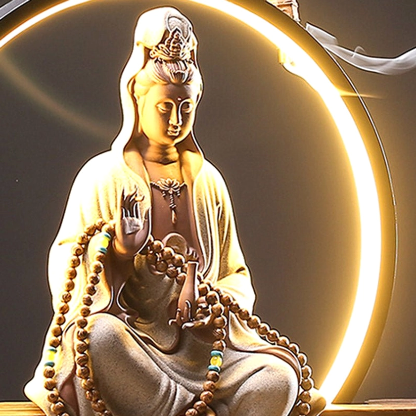 Lotus-adorned Avalokitesvara ceramic incense holder with LED circular halo and meditation ambiance