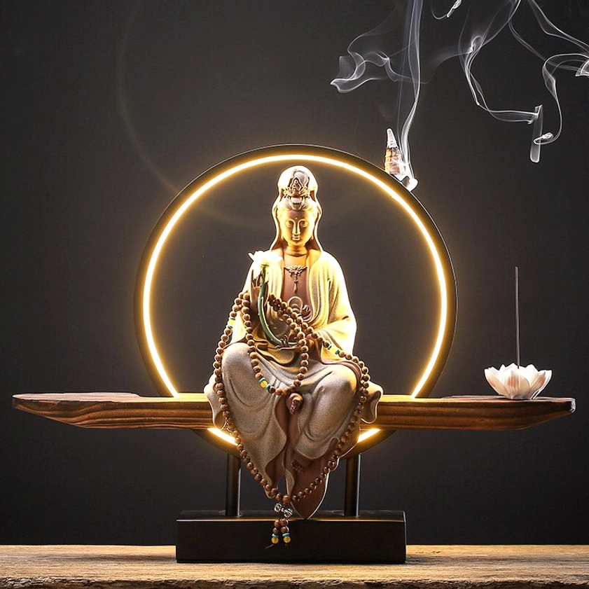 Lotus Avalokitesvara White ceramic backflow incense burner with LED halo, wooden base, and lotus incense tray on display table