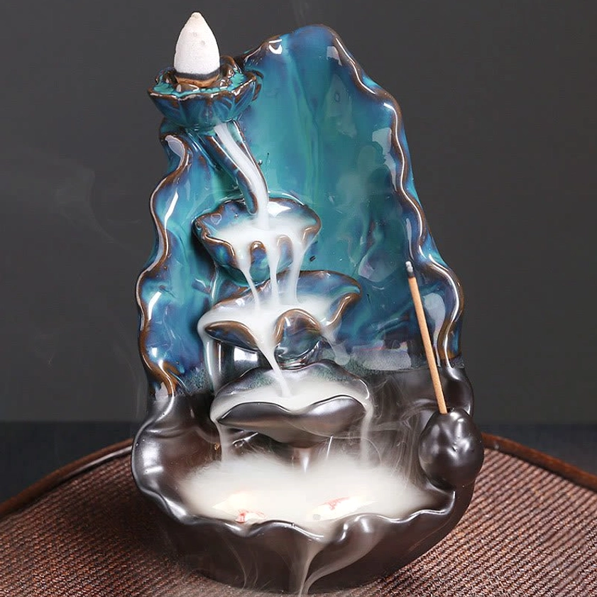 Right front three-quarter view of handcrafted lotus ceramic burner featuring flowing backflow smoke and lotus-shaped catching tray