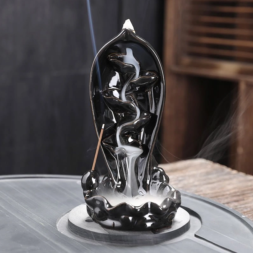 Backflow incense holder with lotus design and koi fish tray showing complete product styling for spiritual meditation space setup