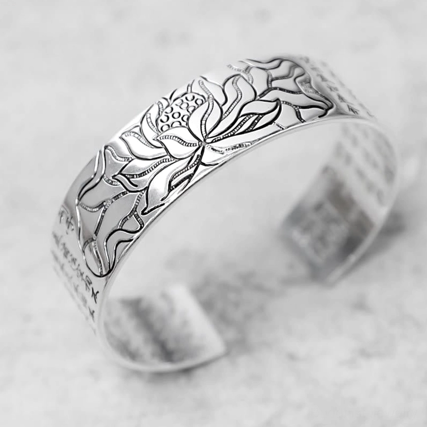 Lotus engraved white copper open cuff bracelet front 3/4 perspective featuring polished finish and Buddhist sutra inscriptions for spiritual protection