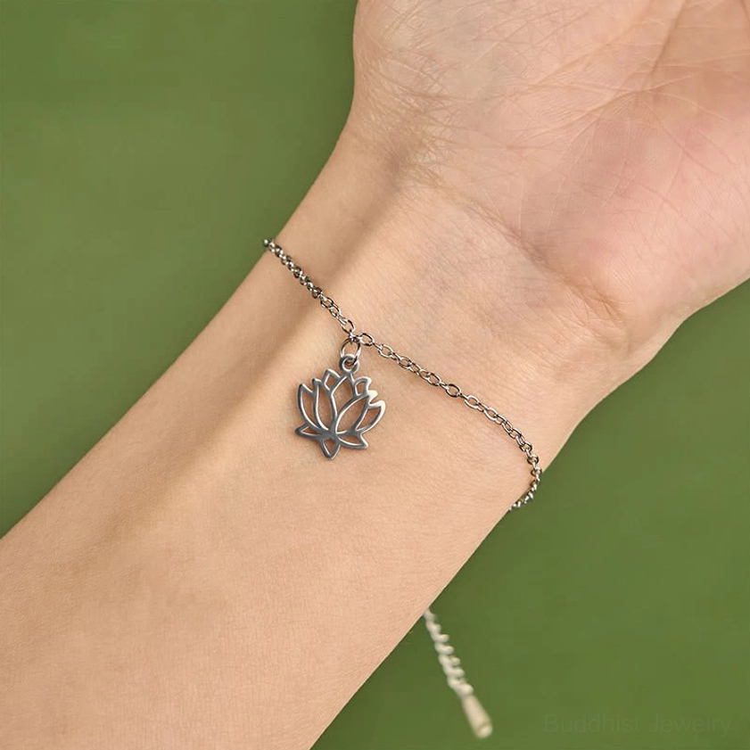 Lotus bracelet worn on wrist showing comfortable fit and silver hollow lotus charm