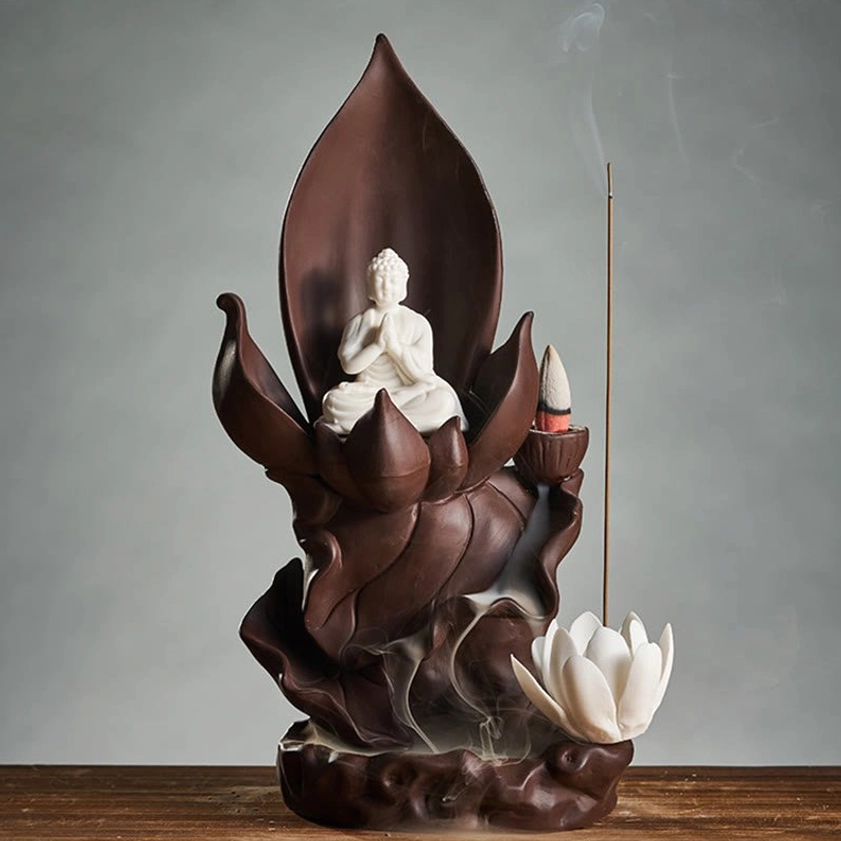 Lotus Tathagata Buddha backflow incense burner with meditating Buddha statue, flowing white smoke on wooden table
