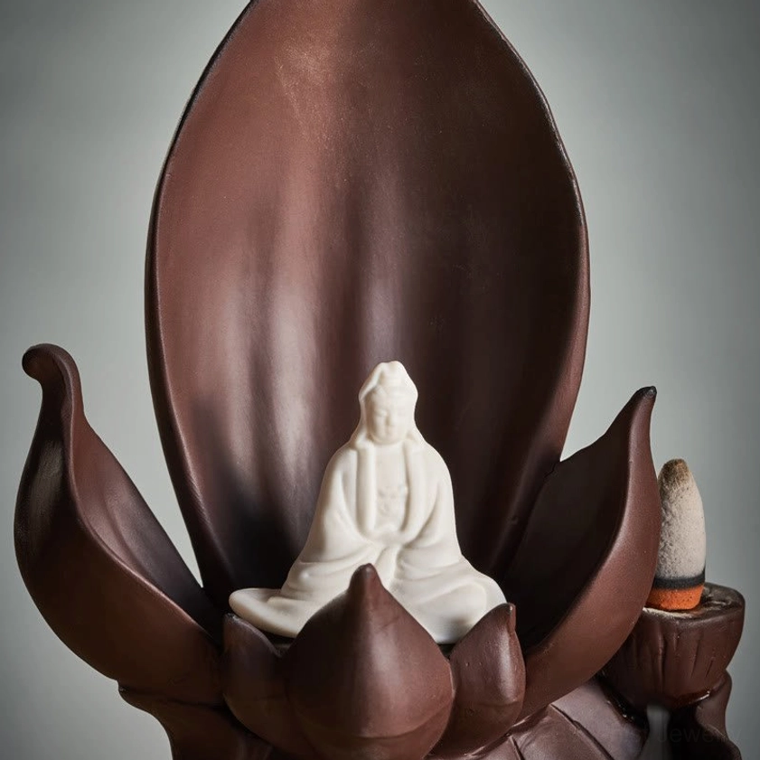 Detailed front close-up of Buddha figure with lotus frame in purple clay incense burner center chamber