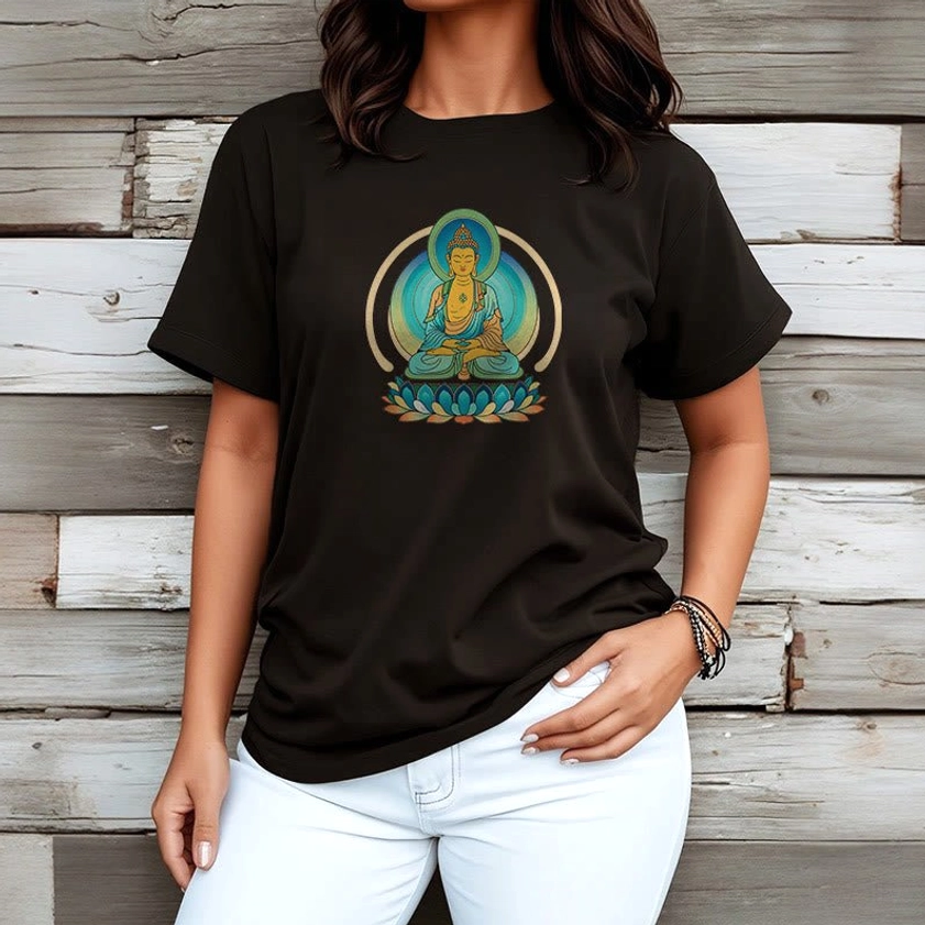 Female model wearing lotus Buddha black graphic t-shirt loose fit wooden plank background