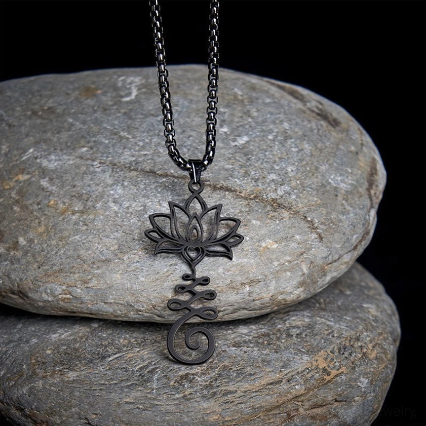 Black hollow carved lotus enlightenment pendant necklace with detailed Buddhist symbol design displayed from front angle