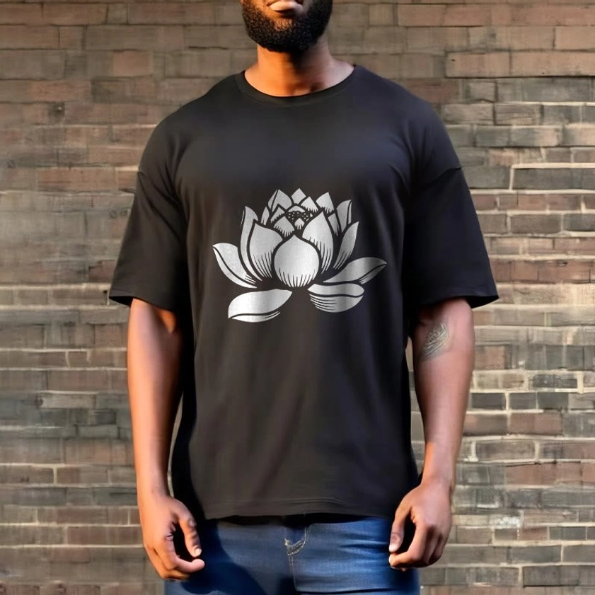 Black lotus flower Buddhist tee styled on model in street style setting with brick wall background