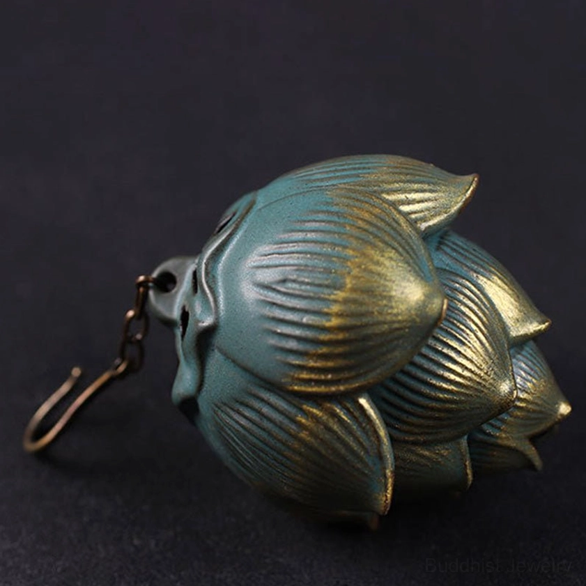 Handcrafted lotus-shaped incense burner showing detailed petal texture and vintage metal coating, left side view on dark background