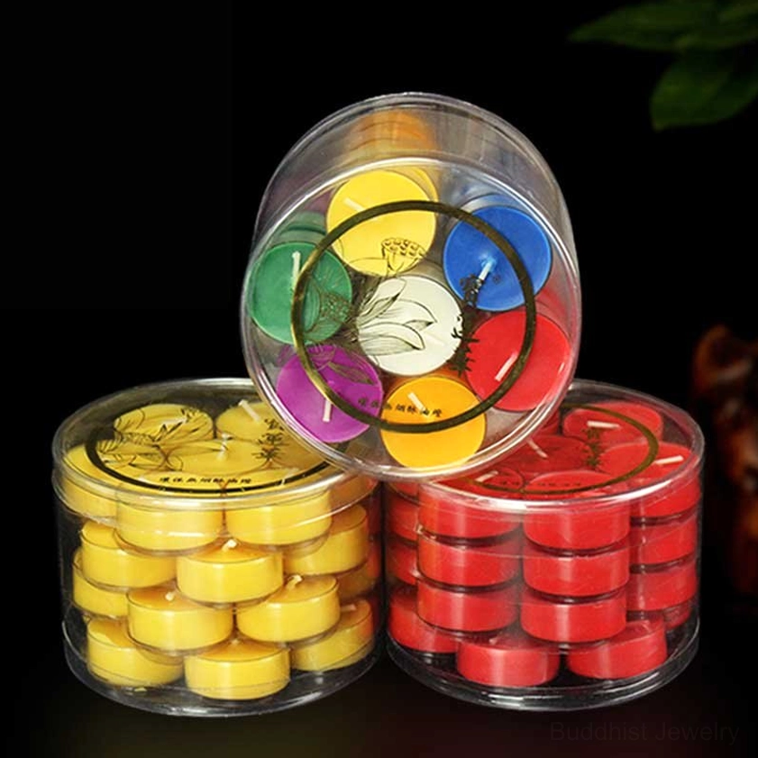 Multi-cup 7-slot lotus candle holder filled with mixed colored tealights creating beautiful ambient lighting for Buddhist altar space