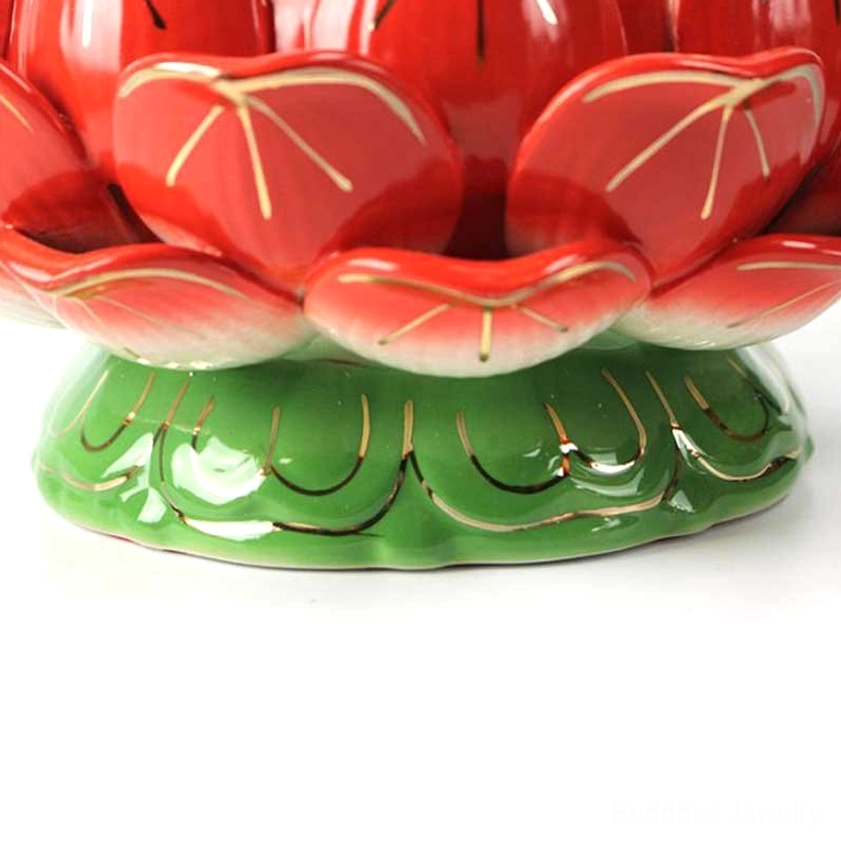 Close-up detail of hand-sculpted lotus petals on ceramic candle holder showing artisan craftsmanship and natural material texture