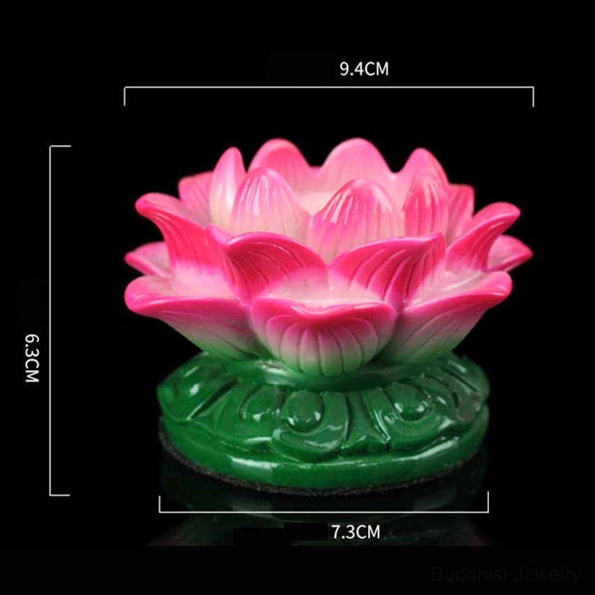 Medium lotus ceramic candle holder in pink with green carved base and size measurement labels, front static view on black background