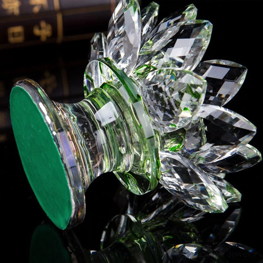 Rear view of crystal lotus candleholder showing green non-slip rubber base pad and transparent faceted crystal structure