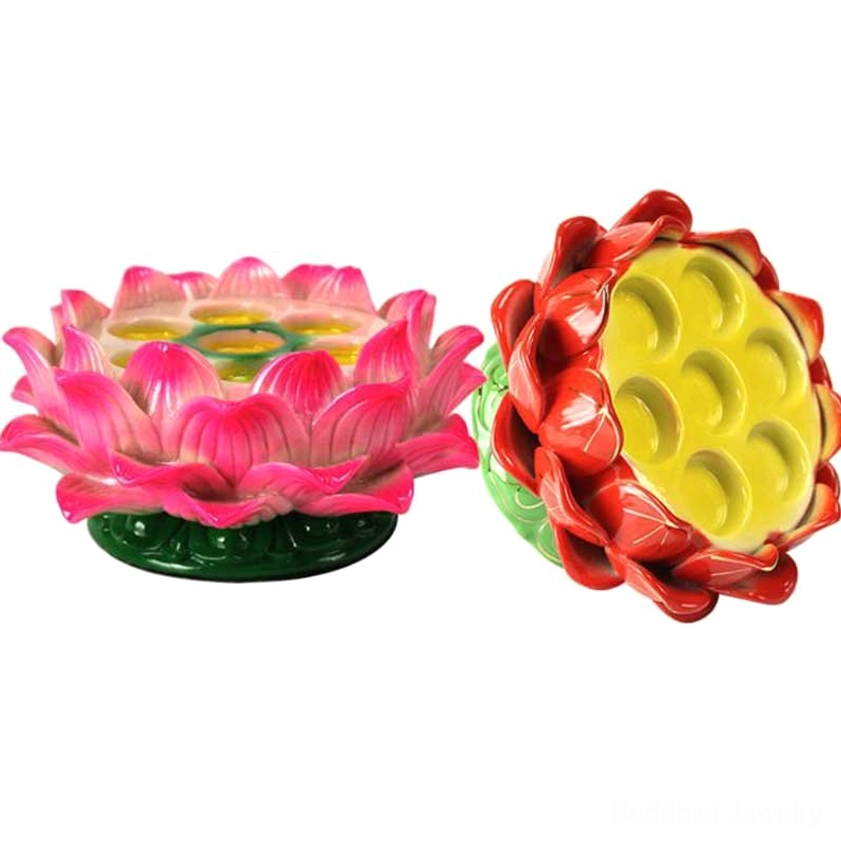 Flat lay comparison of two lotus candle holder types, one showing exposed inner cup structure, pink and red ceramic designs on white background