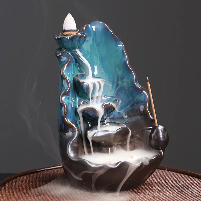 Left side front view of handcrafted lotus ceramic incense burner with layered waterfall smoke flow and side incense stick holder
