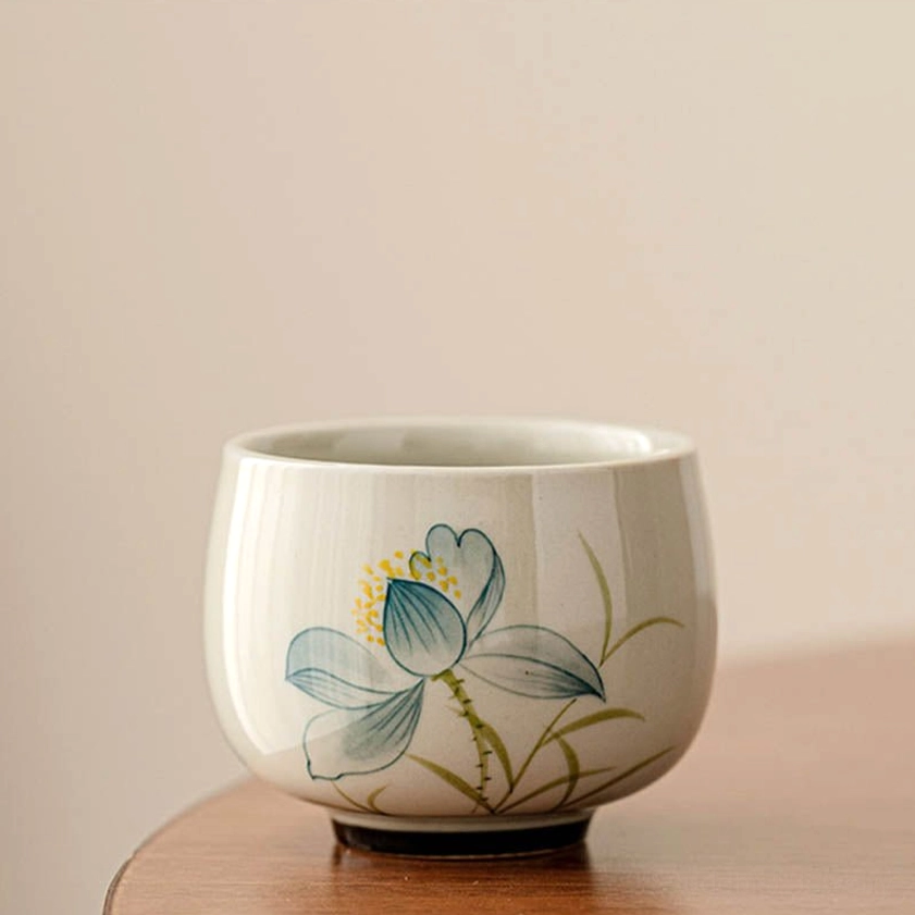 Single round hand-painted ceramic lotus tea cup with cobalt blue petals and golden stamens - authentic Buddhist gongfu tea cup