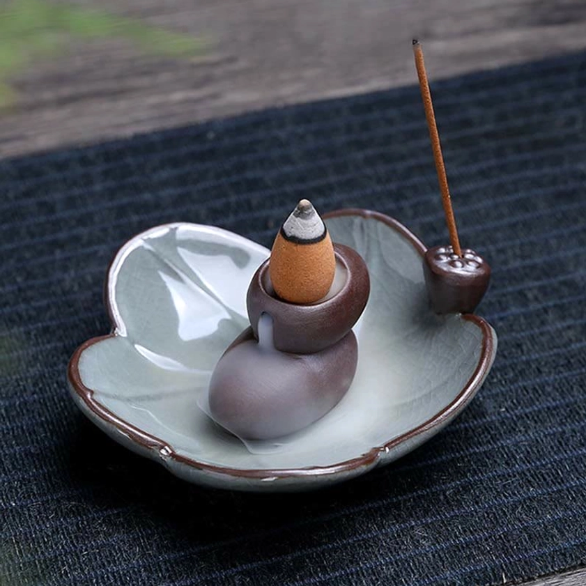 Crackle glaze ceramic incense burner with lotus motif creating meditative backflow smoke effect