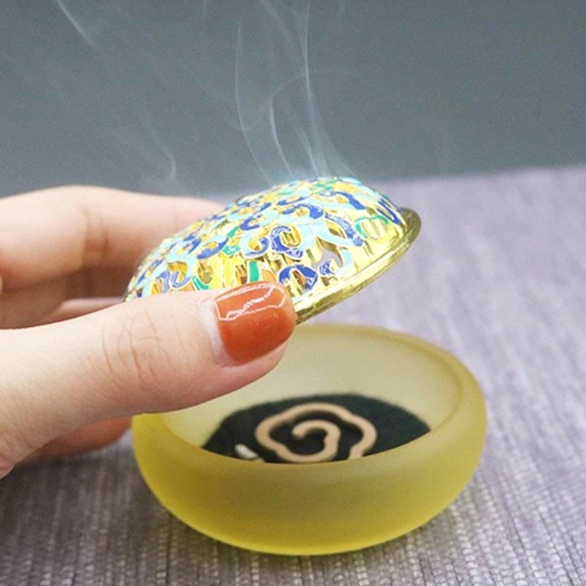 Lotus crystal incense burner collection display showing multiple color variations and sizes