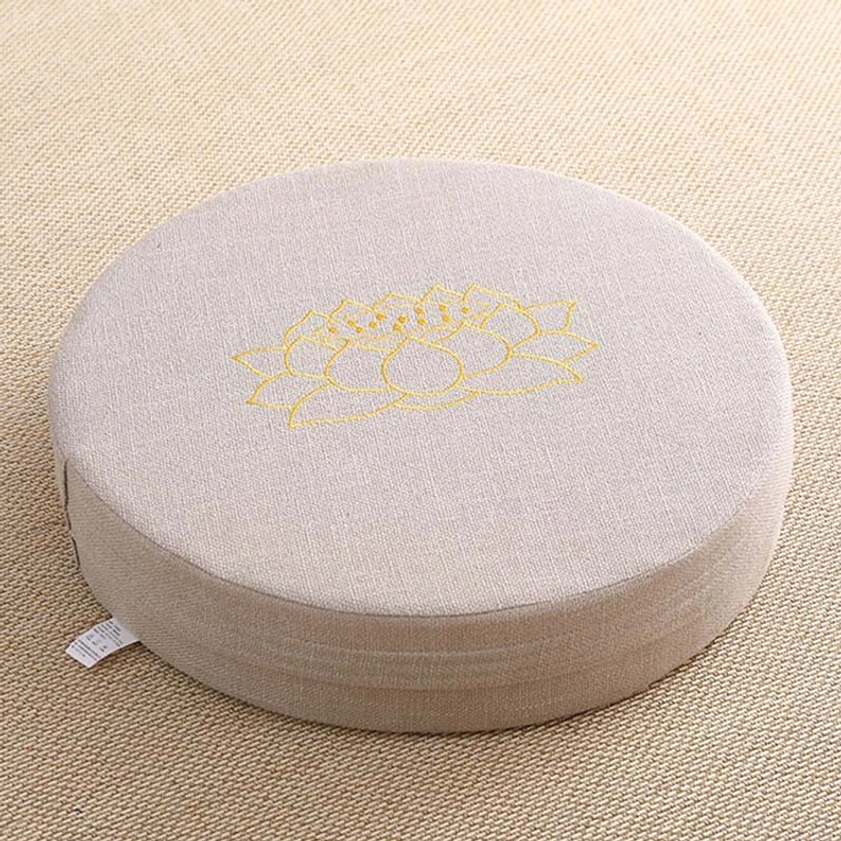 Single round meditation cushion side-top close-up beige linen fabric subtle gold lotus embroidery tag