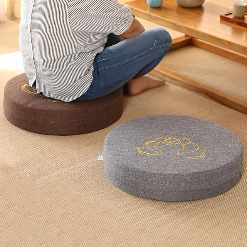 Round meditation seat cushion side view with person sitting tatami tea room brown grey linen gold lotus