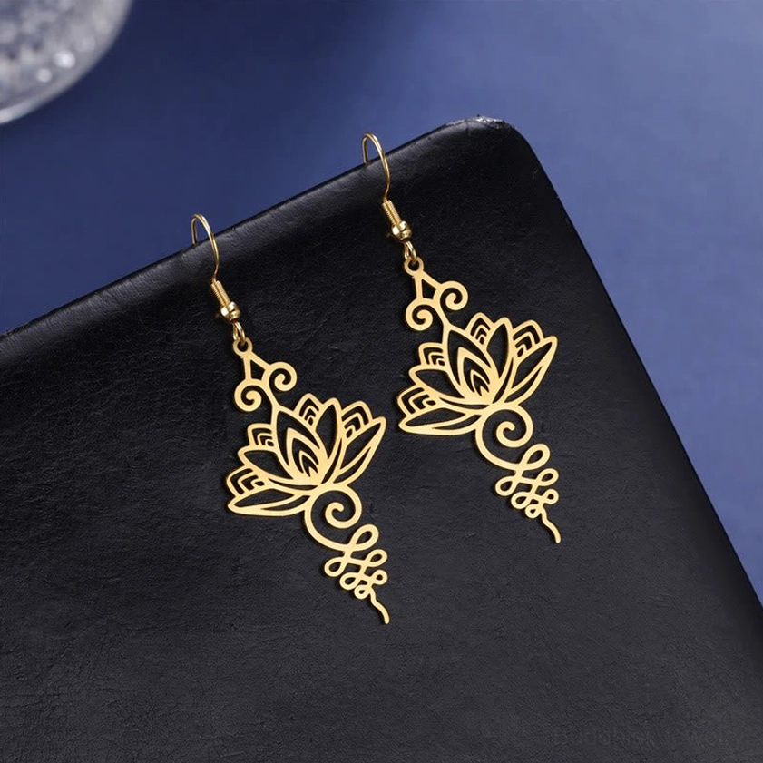 Hollow lotus flower earrings artistic composition showcasing spiritual symbolism and elegance