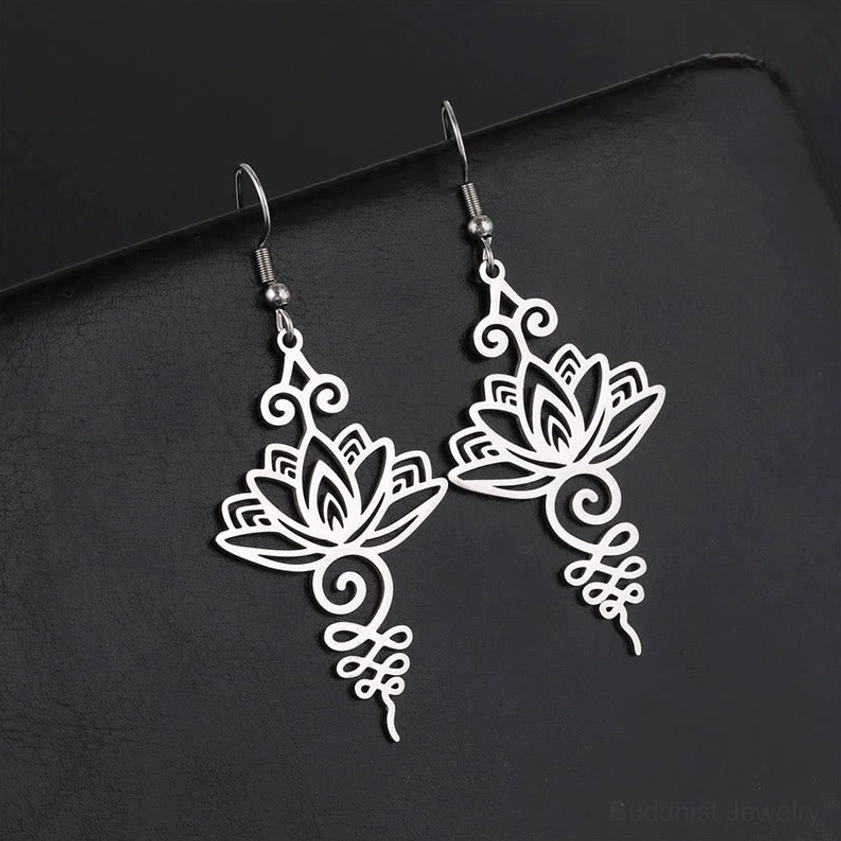 Hollow lotus flower earrings oblique angle showing openwork detail and delicate Buddhist lotus symbolism