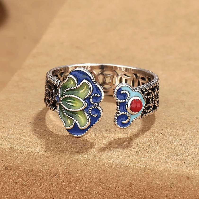 Buddhist lotus flower enamel ring front flat view showing dual motifs and vintage silver finish