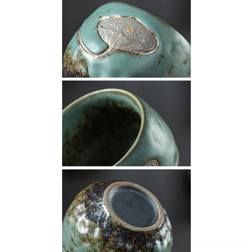 Close-up macro detail of embossed lotus pod engraving with gold trim on ceramic teacup