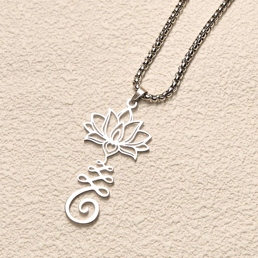 Silver stainless steel lotus symbol pendant necklace displaying detailed hollow carving from upper side angle