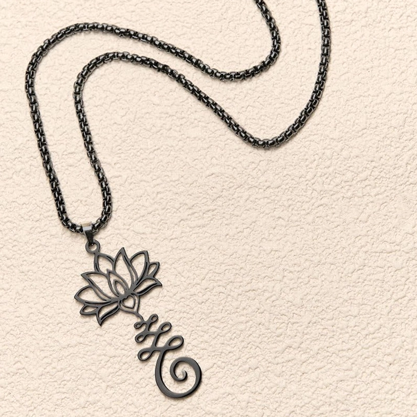 Gold tone lotus symbol pendant necklace with intricate hollow design displayed from upper side shooting angle