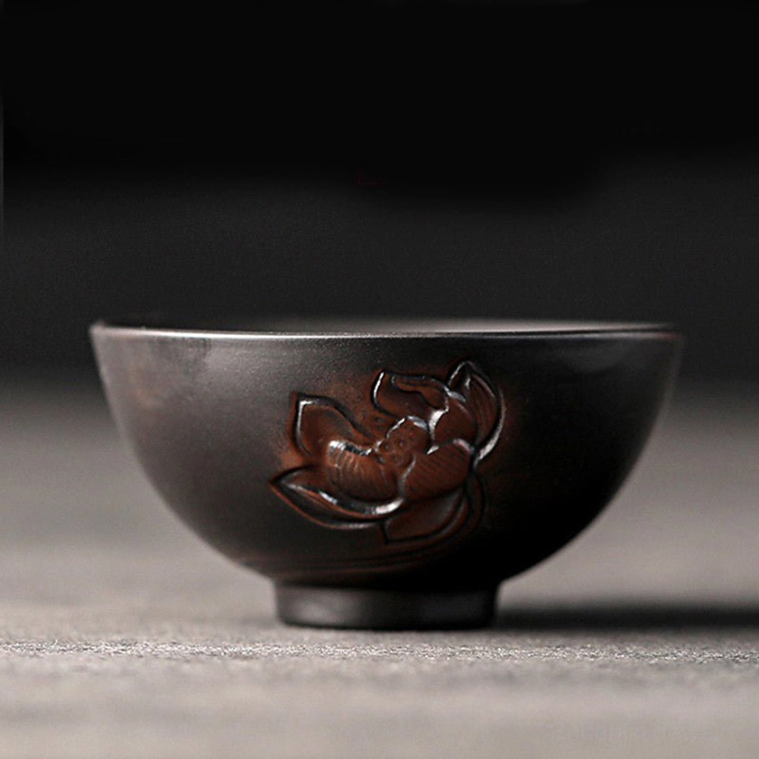 Lotus flower embossed ceramic tea cup representing spiritual awakening and enlightenment in Buddhist tradition