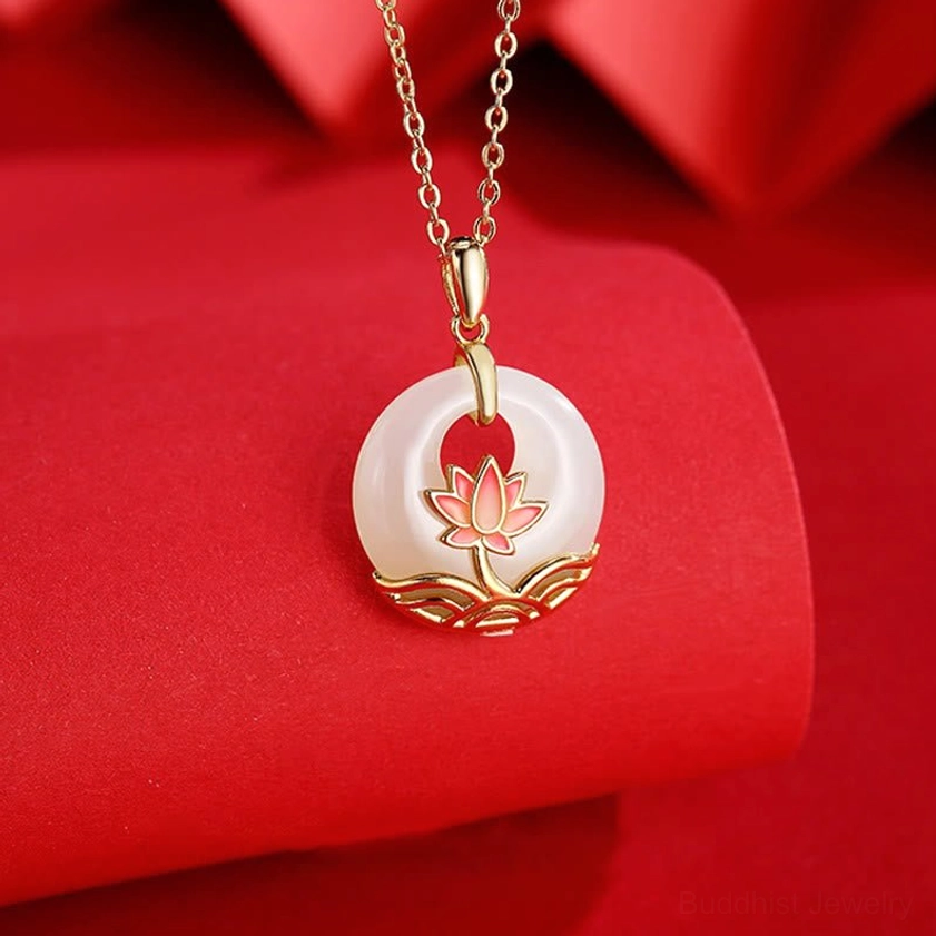 Buddhist lotus flower jade pendant necklace detail shot displaying delicate enamel lotus ornament beneath the jade stone