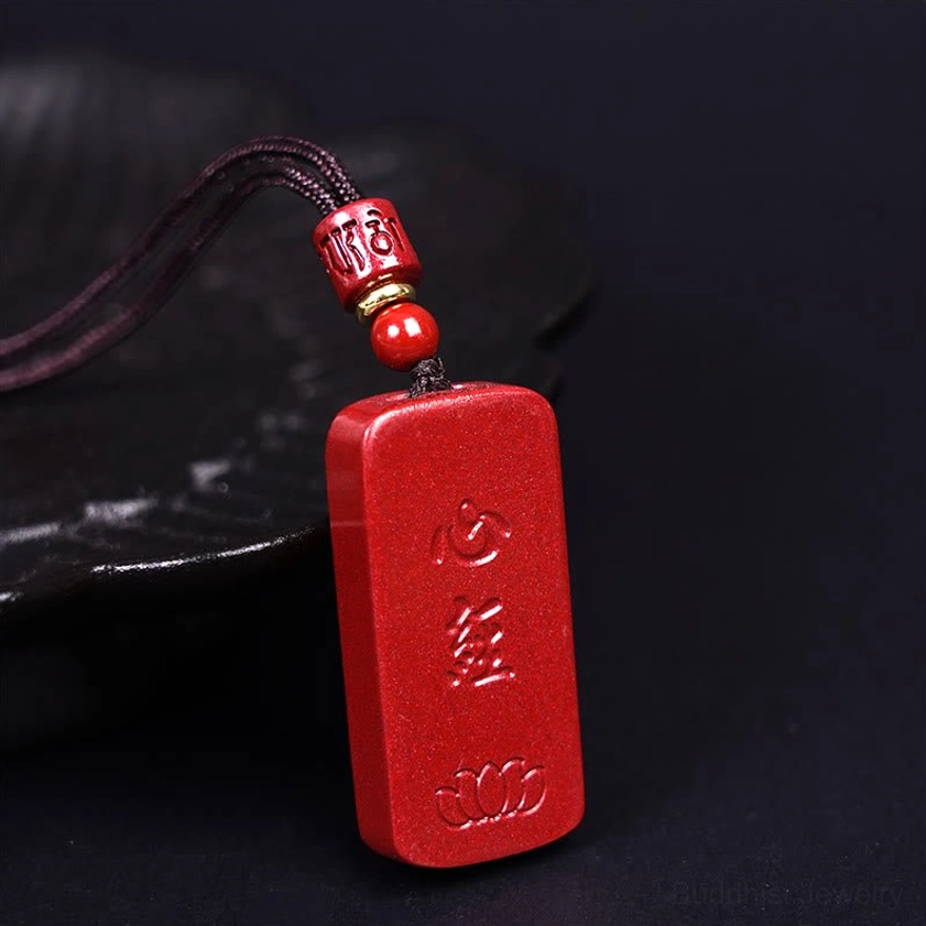 Lotus heart sutra pendant design showing detailed engraving and cinnabar craftsmanship