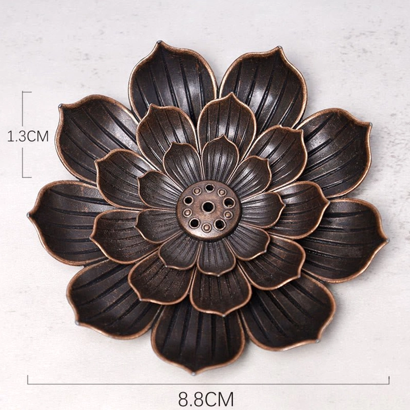 Lotus incense burner bronze holder detail shot showing craftsmanship and petal layering for meditation practice