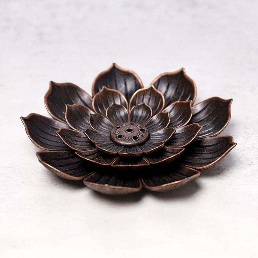 Lotus incense burner overhead view showing full layered lotus shape with multi-hole base on grey countertop