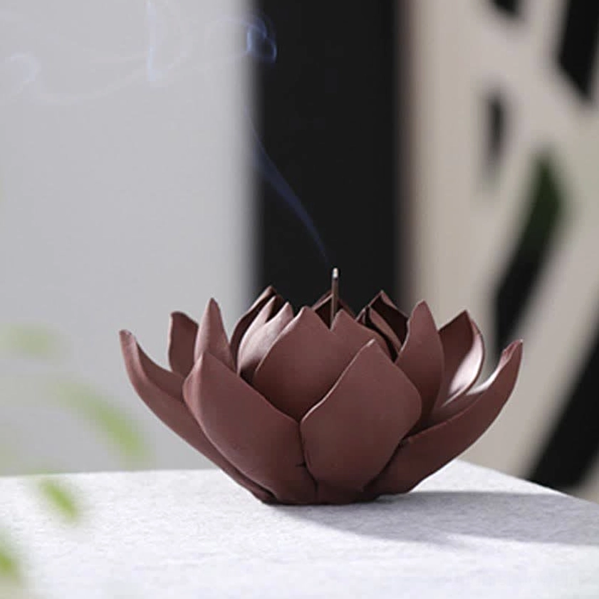 Rear side view of handcrafted lotus incense holder showing rising incense smoke and lattice backdrop