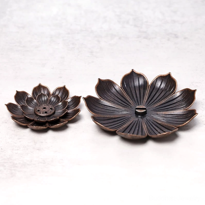 Two lotus incense burner styles comparison top-down view on light grey background, multi-hole and single-slot designs