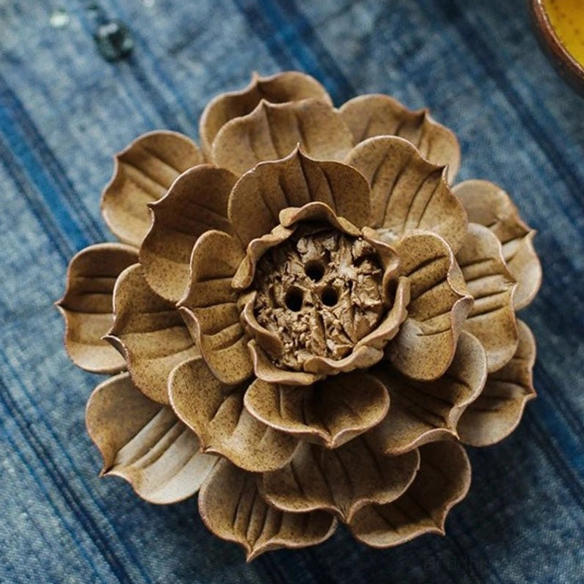Top-down overhead view of layered lotus petal incense holder showing detailed carved flower center design