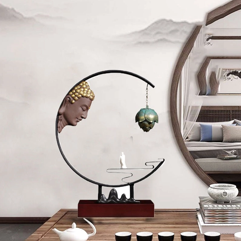 Zen meditation decor with circular metal frame, Buddha head ornament, and lotus hanging incense burner in traditional tea room interior