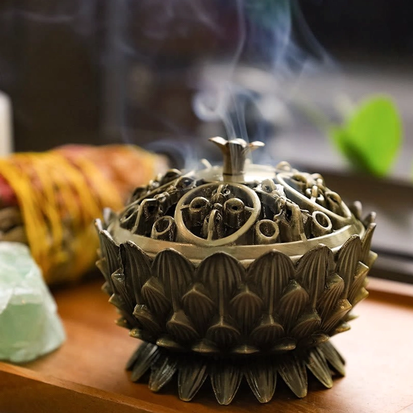 Gunmetal grey lotus incense holder close-up showing visible smoke and intricate openwork hollow lid design