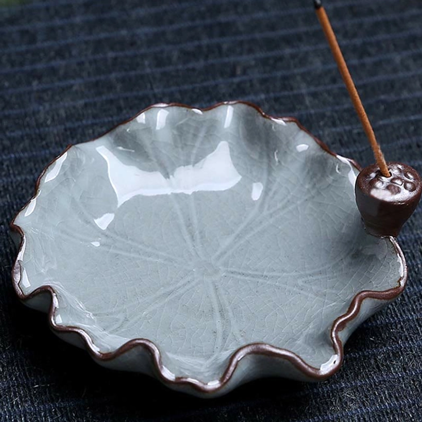 Top-down view of empty lotus leaf incense tray with embossed leaf veins and attached lotus pod stick holder