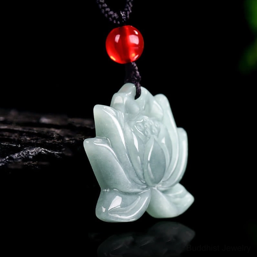 Side profile of hand-carved lotus jade pendant on black cord showing natural jade texture and carving depth