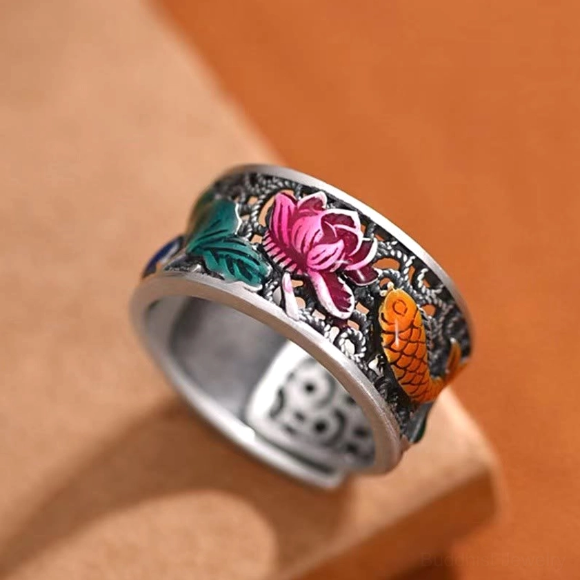 Copper blue enamel lotus koi fish Heart Sutra adjustable ring displayed on wooden platform with oblique top-down view showing intricate cloisonne detailing
