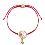 Lotus Koi fish red string bracelet with gold charm and adjustable drawstring, flat lay on white background