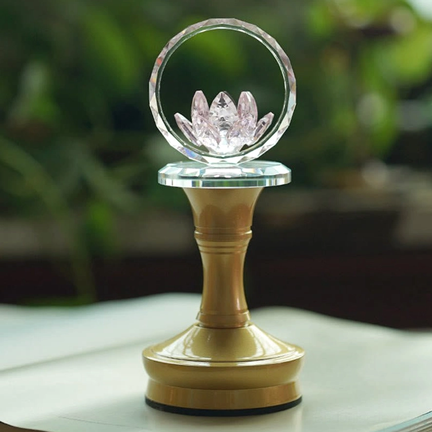 Lotus crystal lamp with copper base showing faceted hoop detail and warm illumination