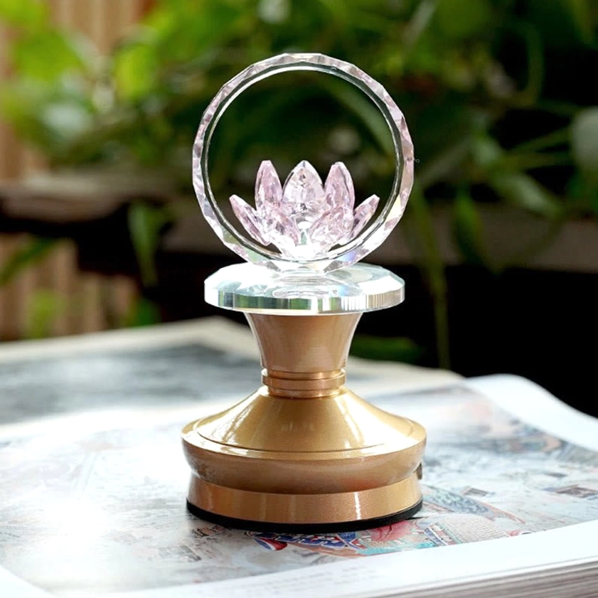Lotus meditation lamp with crystal faceted hoop and copper brass base, close-up detail