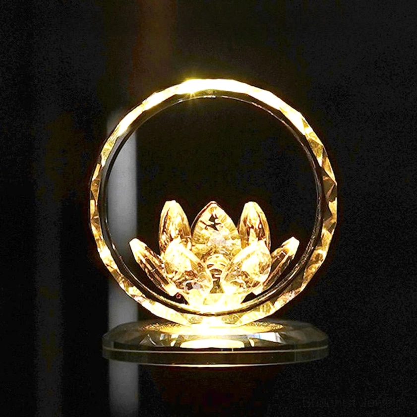 Crystal lotus night light with large faceted gold hoop and warm amber glow, dark ambiance