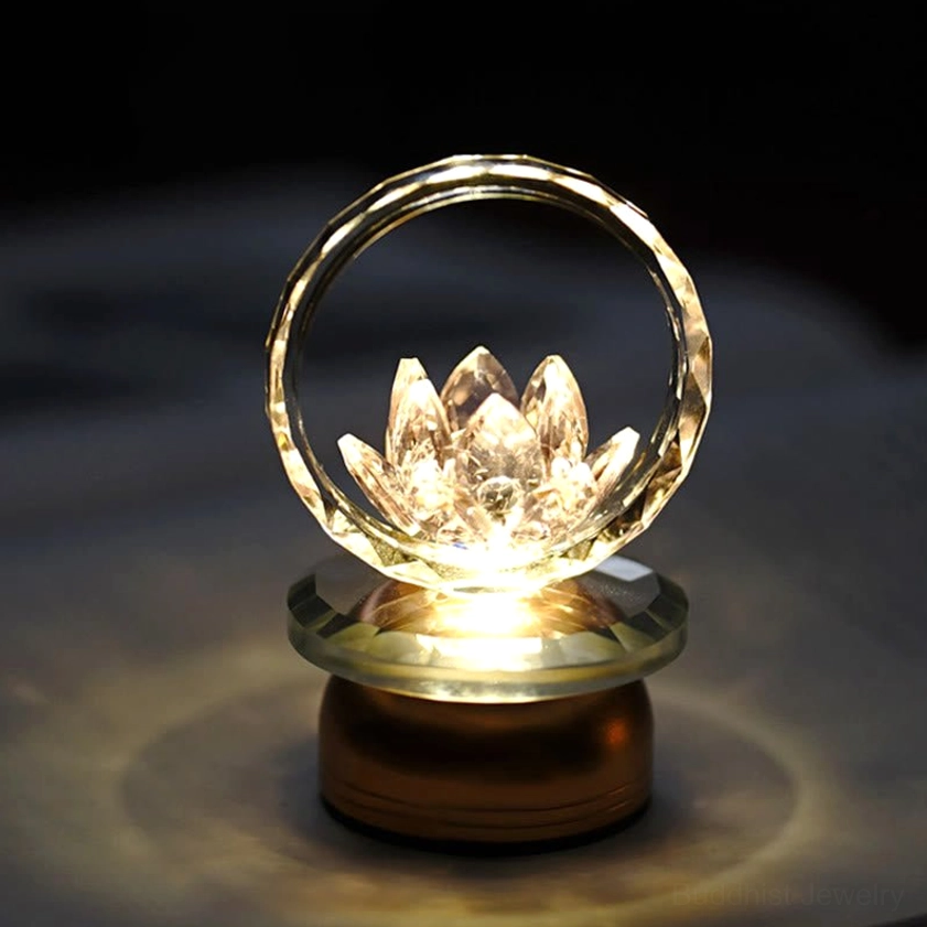 Lotus crystal LED table lamp with warm golden glow and copper brass base, intimate meditation ambiance